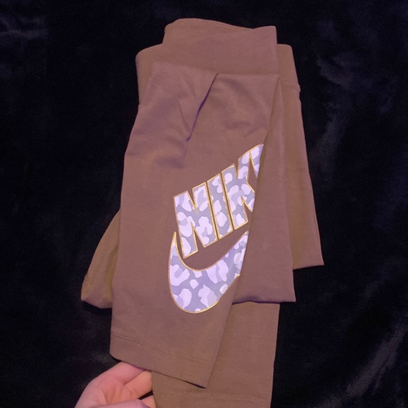 Brown Nike Leggings. Never Worn Before. Camo nike symbol with gold outline. - Picture 3 of 3
